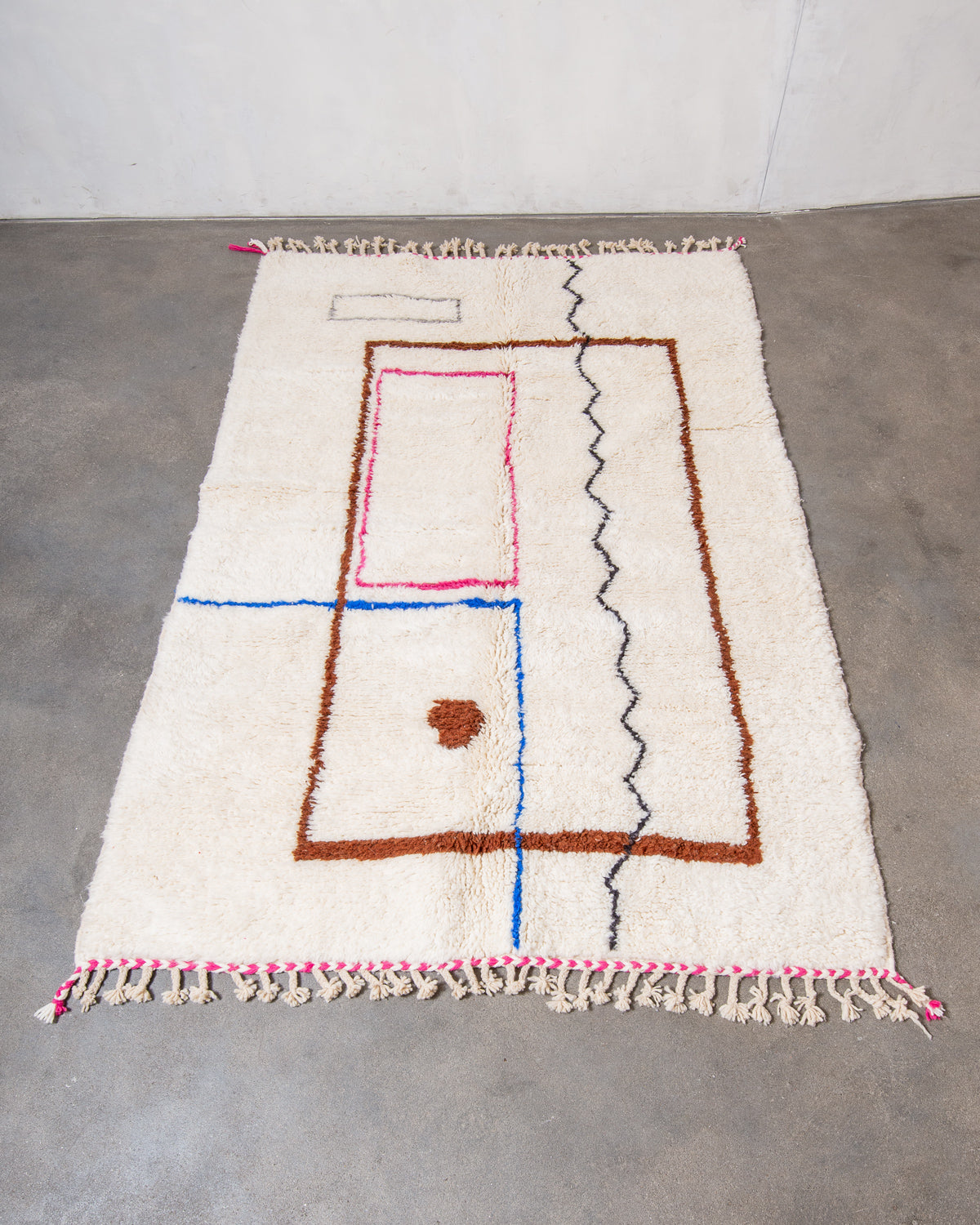 Modern, designer, handcrafted Berber rug from Morocco. Beniourain carpet with beautiful colours and patterns and fluffy wool texture.